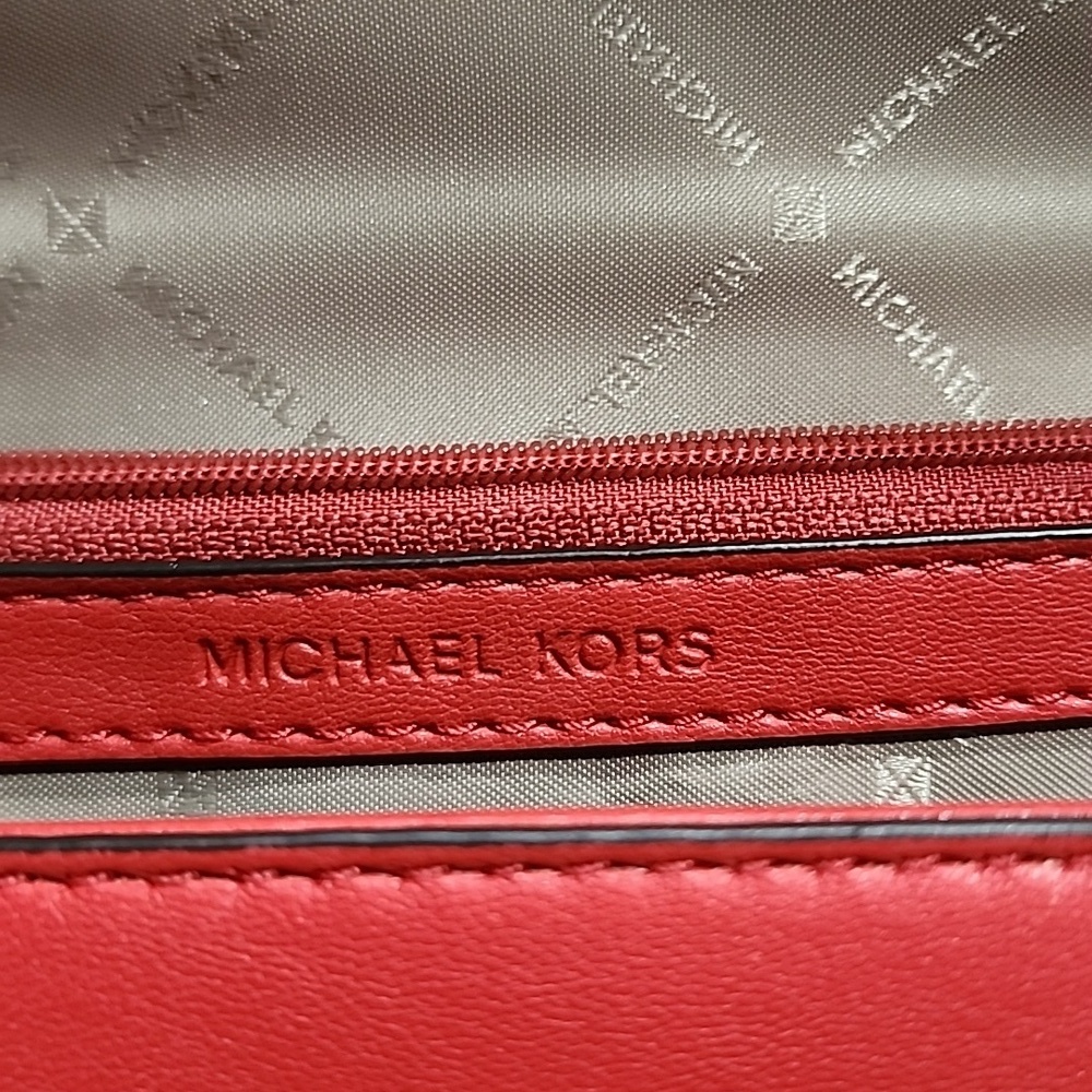 Gently used Michael Kors red leather crossbody bag. - Picture 8 of 12